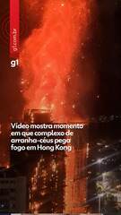 Bombeiros combatendo o incêndio em arranha-céus de Hong Kong